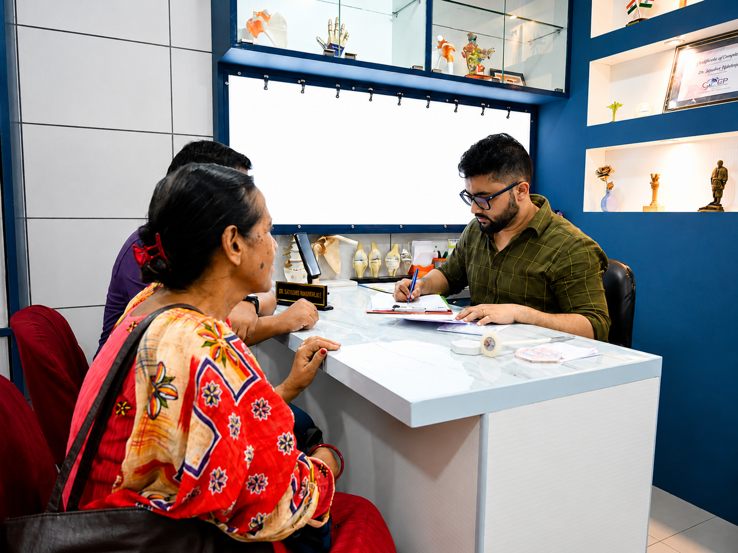 Dr. Soutrik Mukherjee consulting a patient at Advanced Ortho and Spine Clinic
